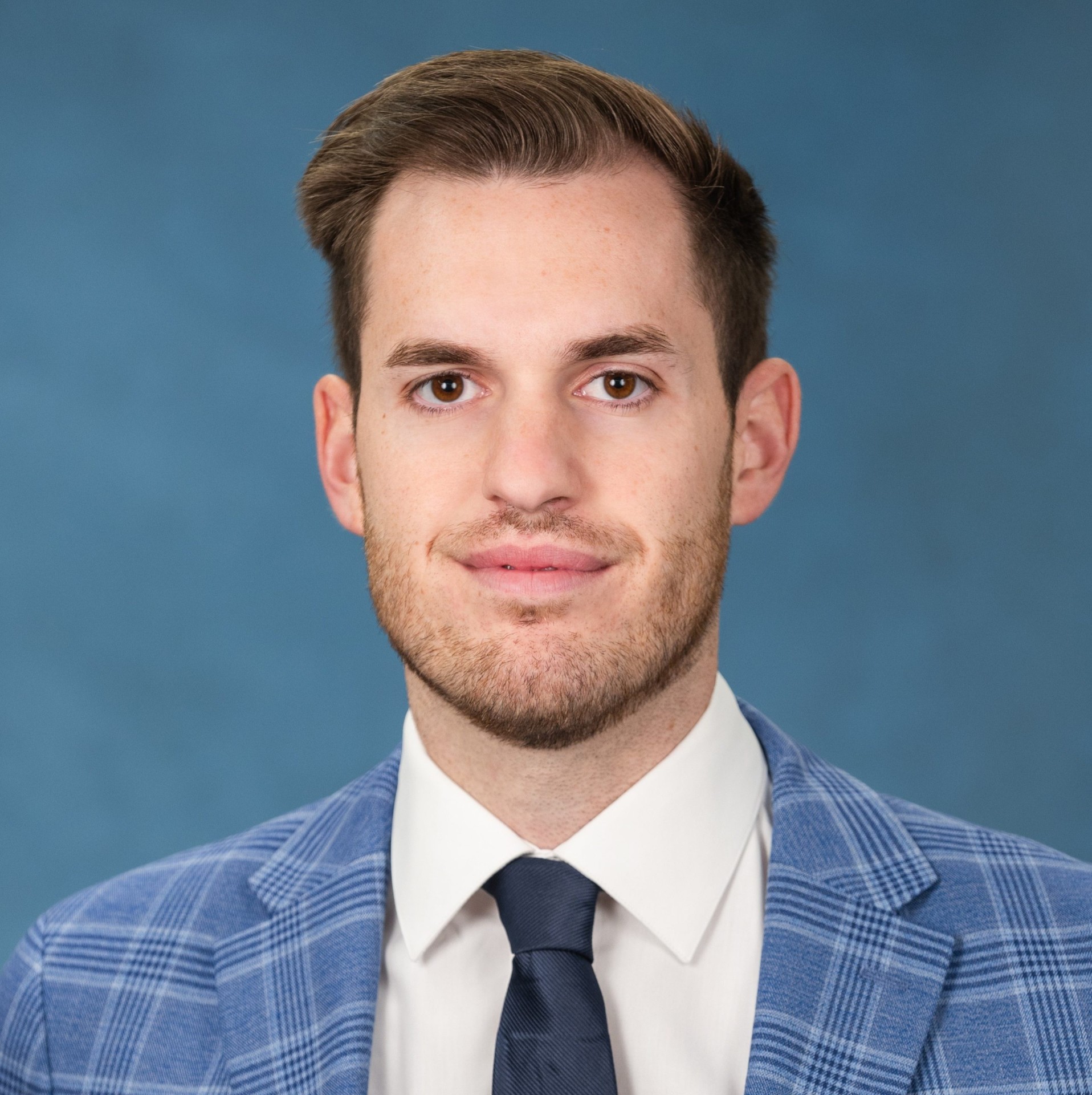 Portrait of Niko Piccolo, Investment Analyst at Summit Financial
